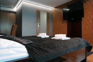 Postel nebo postele na pokoji v ubytování Hotel Oskar Business & Spa