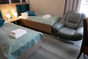 Postel nebo postele na pokoji v ubytování Hotel Oskar Business & Spa