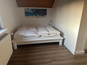 מיטה או מיטות בחדר ב-Wolburg am Grossensee