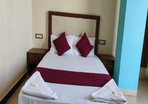 Postel nebo postele na pokoji v ubytování Hotel Blue Sky Residency