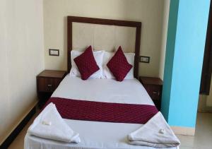 Postel nebo postele na pokoji v ubytování Hotel Blue Sky Residency