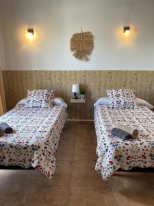 Postel nebo postele na pokoji v ubytování Hostal Espai Mediterrani