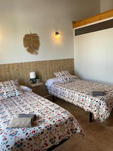 Postel nebo postele na pokoji v ubytování Hostal Espai Mediterrani