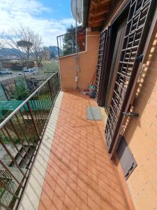 an outside balcony of a house with a staircase at Casa Marzia&Daniele in Rome
