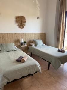 Postel nebo postele na pokoji v ubytování Hostal Espai Mediterrani