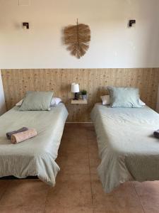 Postel nebo postele na pokoji v ubytování Hostal Espai Mediterrani