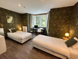 Postel nebo postele na pokoji v ubytování Le Tri Renard Spa + 37 fotografií