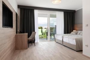 Voodi või voodid majutusasutuse Kaneo beach hotel Novalja toas