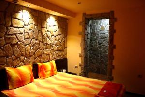 Ένα ή περισσότερα κρεβάτια σε δωμάτιο στο Todorovi Guest House