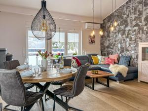 a living room with a table and a couch at Am Höhlchen in Olsberg