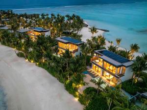 an aerial view of a resort on the beach at SO/ Maldives in South Male Atoll