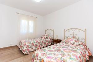 Postel nebo postele na pokoji v ubytování Villa Santa Lucia + 37 fotografií
