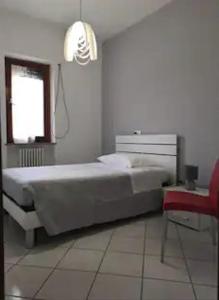 Ein Bett oder Betten in einem Zimmer der Unterkunft Bilocale centrale 80 MQ, con terrazza abitabile