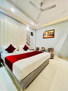 a bedroom with a large bed in a room at Hotel NASHA Unit By Worth New Delhi in New Delhi