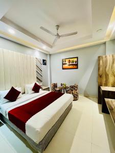 a bedroom with a large bed in a room at Hotel NASHA Unit By Worth New Delhi in New Delhi
