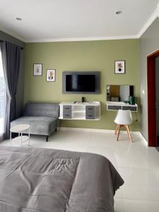 Μια τηλεόραση ή/και κέντρο ψυχαγωγίας στο Melza room no.3