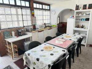 a kitchen with two tables and a kitchen with a counter at 7 Calcosas in Valverde