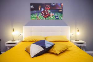 Katil atau katil-katil dalam bilik di Napoli Games Apartments by Dimorra