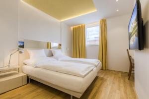 Posteľ alebo postele v izbe v ubytovaní Vienna Grand Apartments DANUBE
