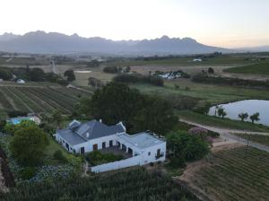 an aerial view of a house in a vineyard at Aan-Den-Weg in Stellenbosch