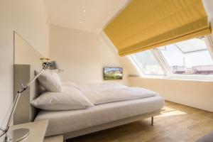 Posteľ alebo postele v izbe v ubytovaní Vienna Grand Apartments DANUBE