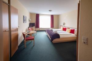 Voodi või voodid majutusasutuse Hotel & Restaurant Zum Kap Arkona toas