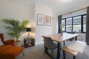 a living room with a table and a couch at Unicorn House Hot Tub Near Barnard Castle in Barnard Castle