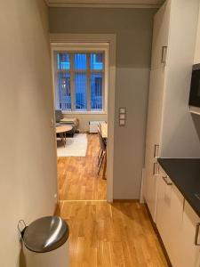 a hallway with a kitchen and a living room at Lovely apartment in Bergen in Bergen