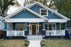 a blue house with a white front porch at Cozy Retreat Near Downtown, Atl in Atlanta