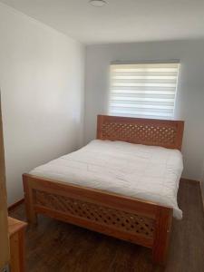 Ένα ή περισσότερα κρεβάτια σε δωμάτιο στο Casa por día en Puerto Varas