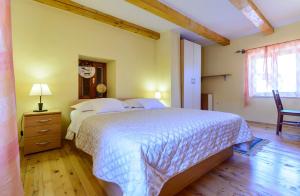 a bedroom with a large bed and a wooden floor at Vila Donna Apartments in Trogir +34 photos