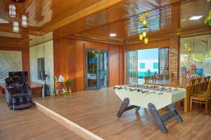 a large room with a table with birds on it at Khoảnh Khăc Homestay in Vung Tau