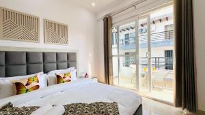 Postel nebo postele na pokoji v ubytování ZEN Suites - Golf Course Road Gurgaon + 25 fotografií