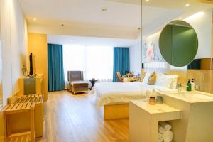 Voodi või voodid majutusasutuse Paco Hotel Beijing Road Tuan Yi Da Metro Guangzhou toas