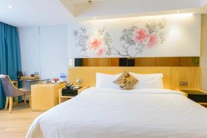 Voodi või voodid majutusasutuse Paco Hotel Beijing Road Tuan Yi Da Metro Guangzhou toas