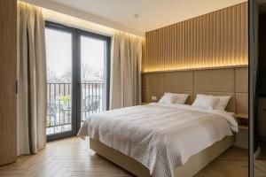 Postel nebo postele na pokoji v ubytování AVAPARTS Apartament FAMILY