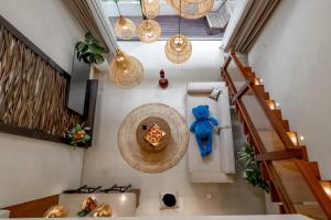 a staircase with a blue teddy bear in a room at Sunny Cuddles in Canggu