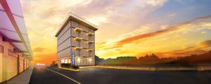 a rendering of a building with a sunset in the background at i NEED Motel in Xinfeng