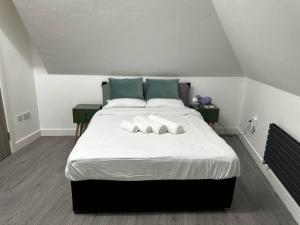 a bedroom with a bed with two pillows on it at 1Bedroom Flat Central London NW3 in London