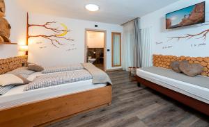Postel nebo postele na pokoji v ubytování Hotel Aida
