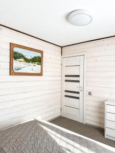 a room with white walls and a door at Софія in Yasinya