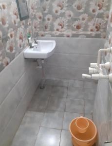a bathroom with a sink and a toilet at International Hotel In in Gorakhpur