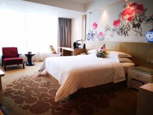 Voodi või voodid majutusasutuse Paco Hotel Beijing Road Tuan Yi Da Metro Guangzhou toas