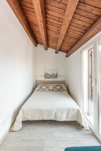 Säng eller sängar i ett rum på Casa Brunaccini con Terrazza by Wonderful Italy