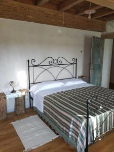 a bedroom with a large bed in a room at La Casa di LILLIA in Castelnovo neʼ Monti