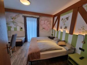 Postel nebo postele na pokoji v ubytování Hotel Aida