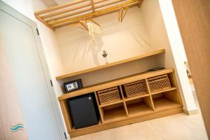 a small room with a tv in the corner at Plataria Seaside Resort in Plataria