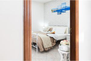 Postel nebo postele na pokoji v ubytování B&B VESUVIAN STONE