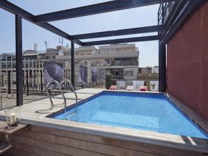 a swimming pool on the roof of a building at Barcino Inversions - Fully equipped apartments near the Beach with shared pool in Barcelona