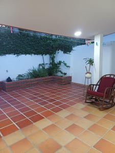 a room with a patio with a fish tank at Casa Bellavista Barranquilla in Barranquilla